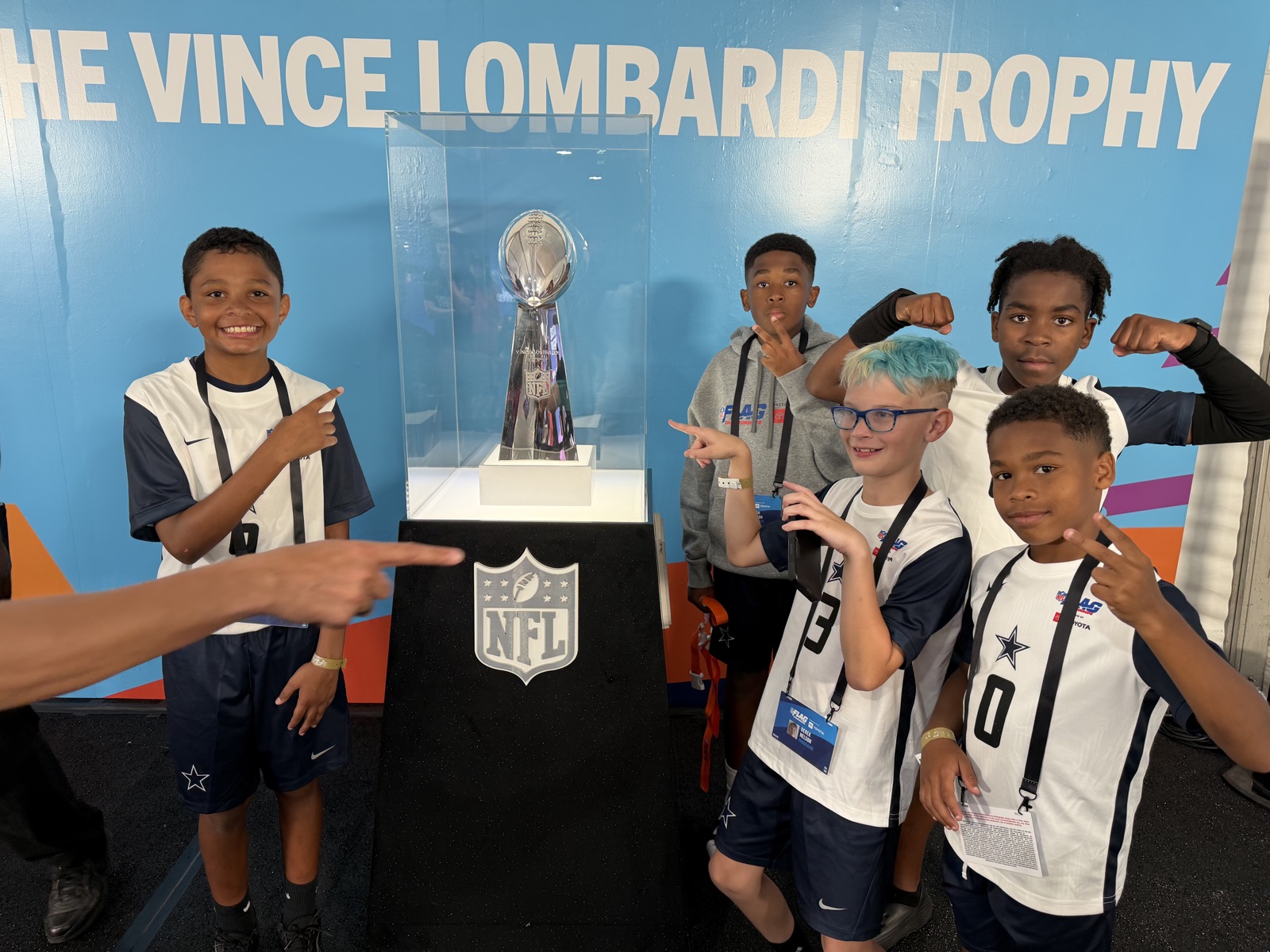 Frisco Elite players with the Vince Lombardi Trophy at the NFL FLAG Championships